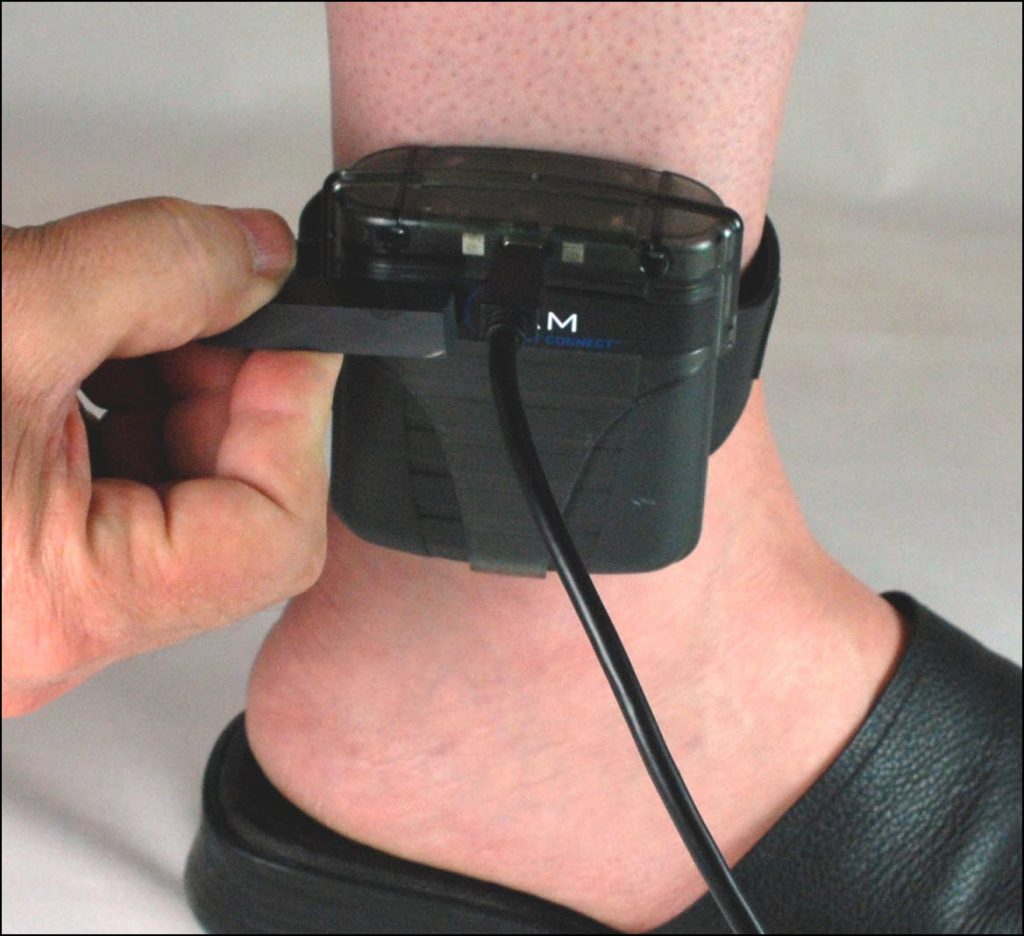 A hand holding a cellphone Description automatically generated