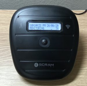 wireless base station's LCD screen displaying a message of monitoring