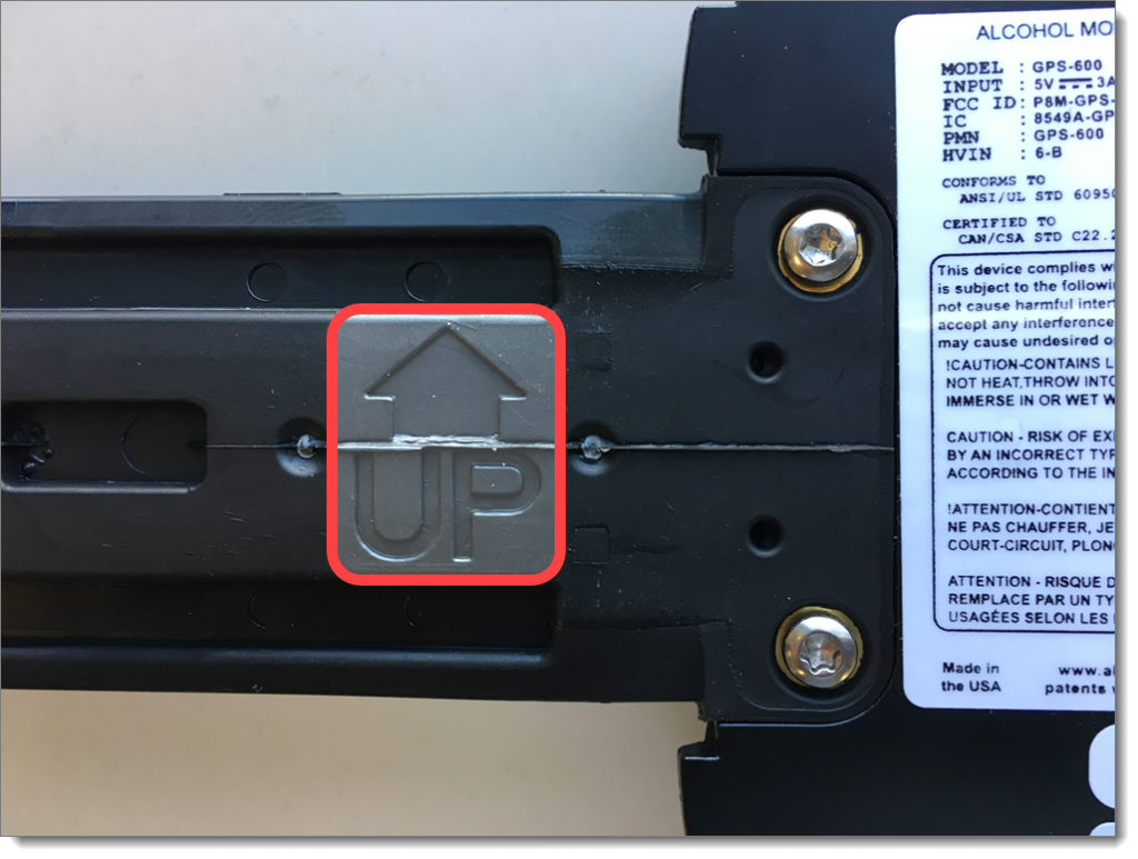 Inside of GPS strap showing the word up and an arrow pointing up