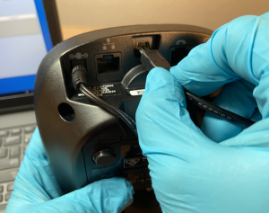 Image of Plugging Direct Connect Cabel into the Back of Base Station