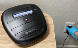 Image Plugging Wireless Base Station into Power Outlet