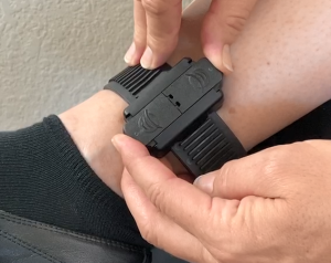 Image of pushing the tamper clips together